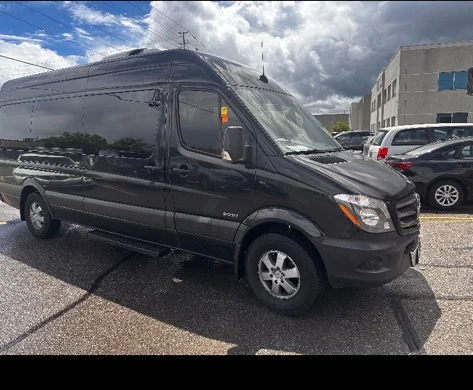 Black executive sprinter van prepared for private car service and airport transfers.