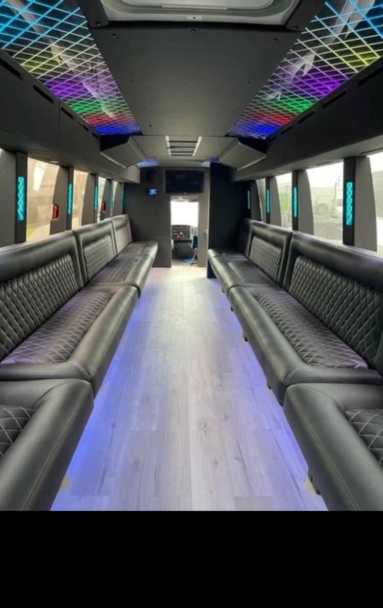 LED-lit ALR party bus interior with wraparound bench seating.