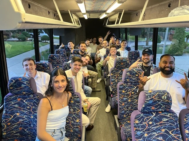Passengers riding together inside an ALR shuttle bus during group transportation.